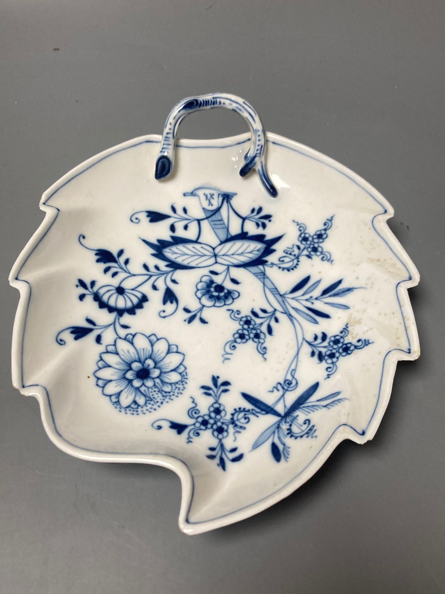 A Meissen blue and white onion pattern jug and a similar leaf shaped pickle dish (2)